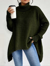 Oversize strikbluse med rullekrave – asymmetrisk