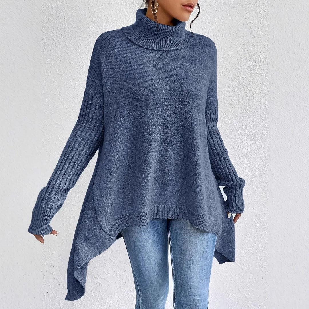 Oversize strikbluse med rullekrave – asymmetrisk