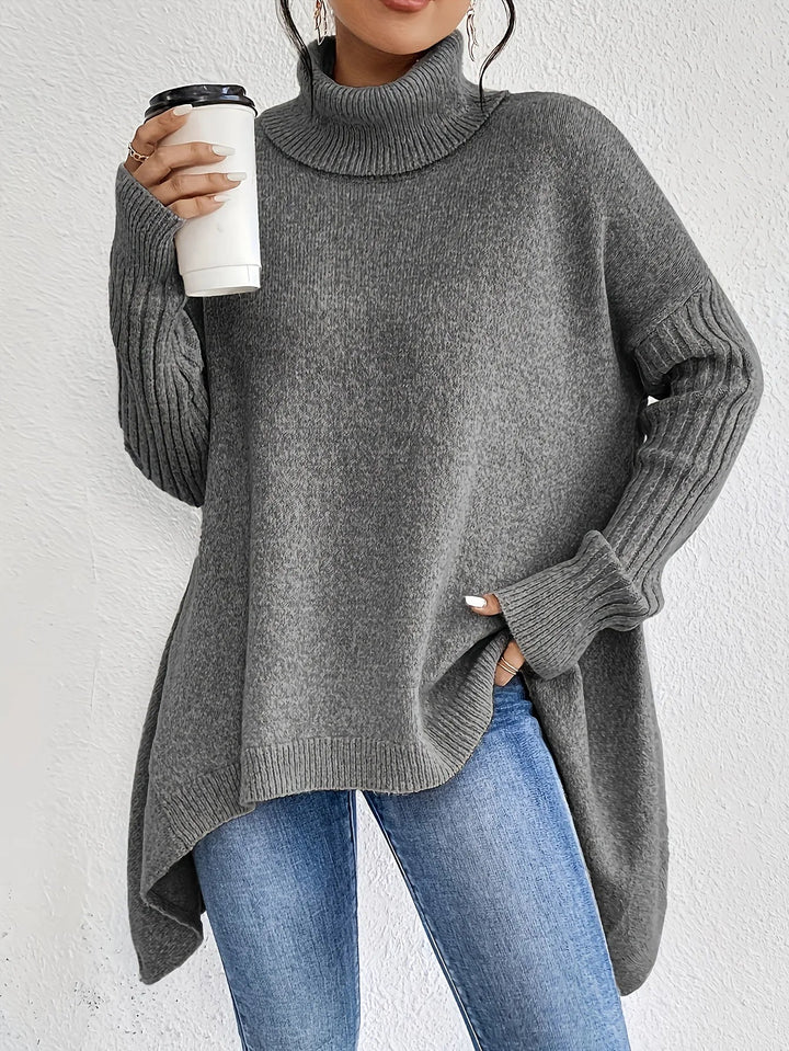 Oversize strikbluse med rullekrave – asymmetrisk – Grå